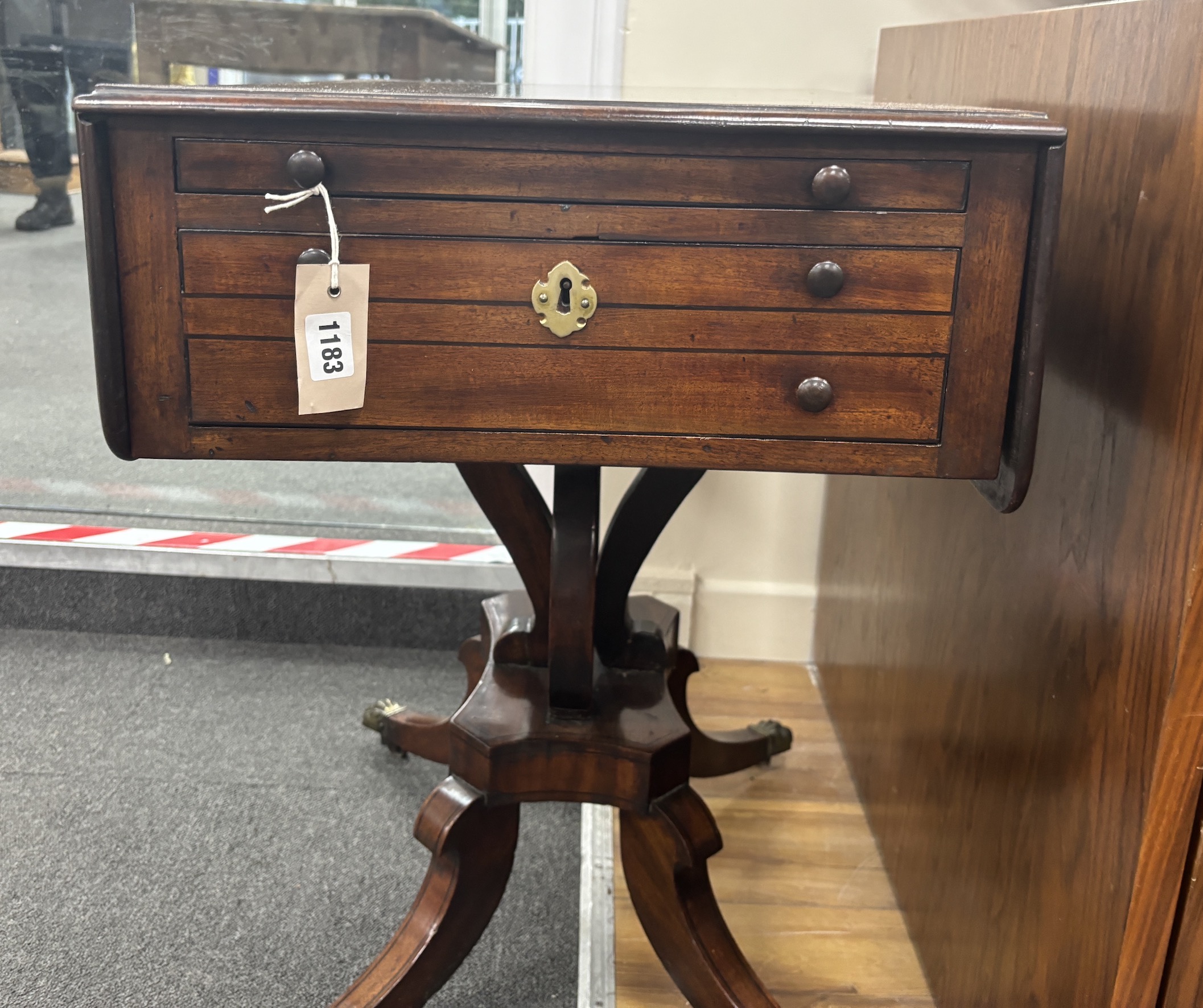 A Regency ebony strung mahogany drop flap two drawer work table, width 45cm, depth 64cm, height 67cm.